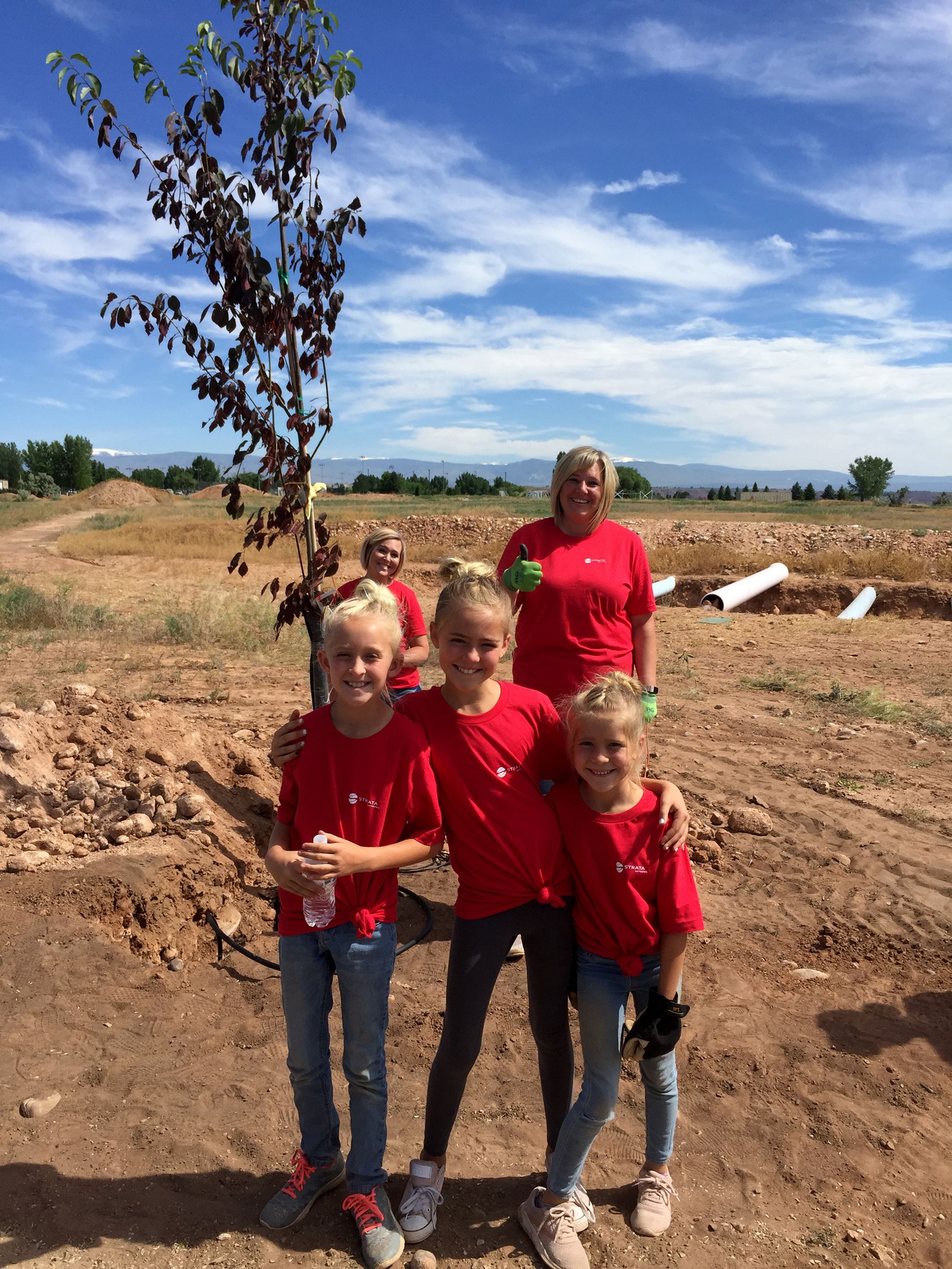 girls with planted tree