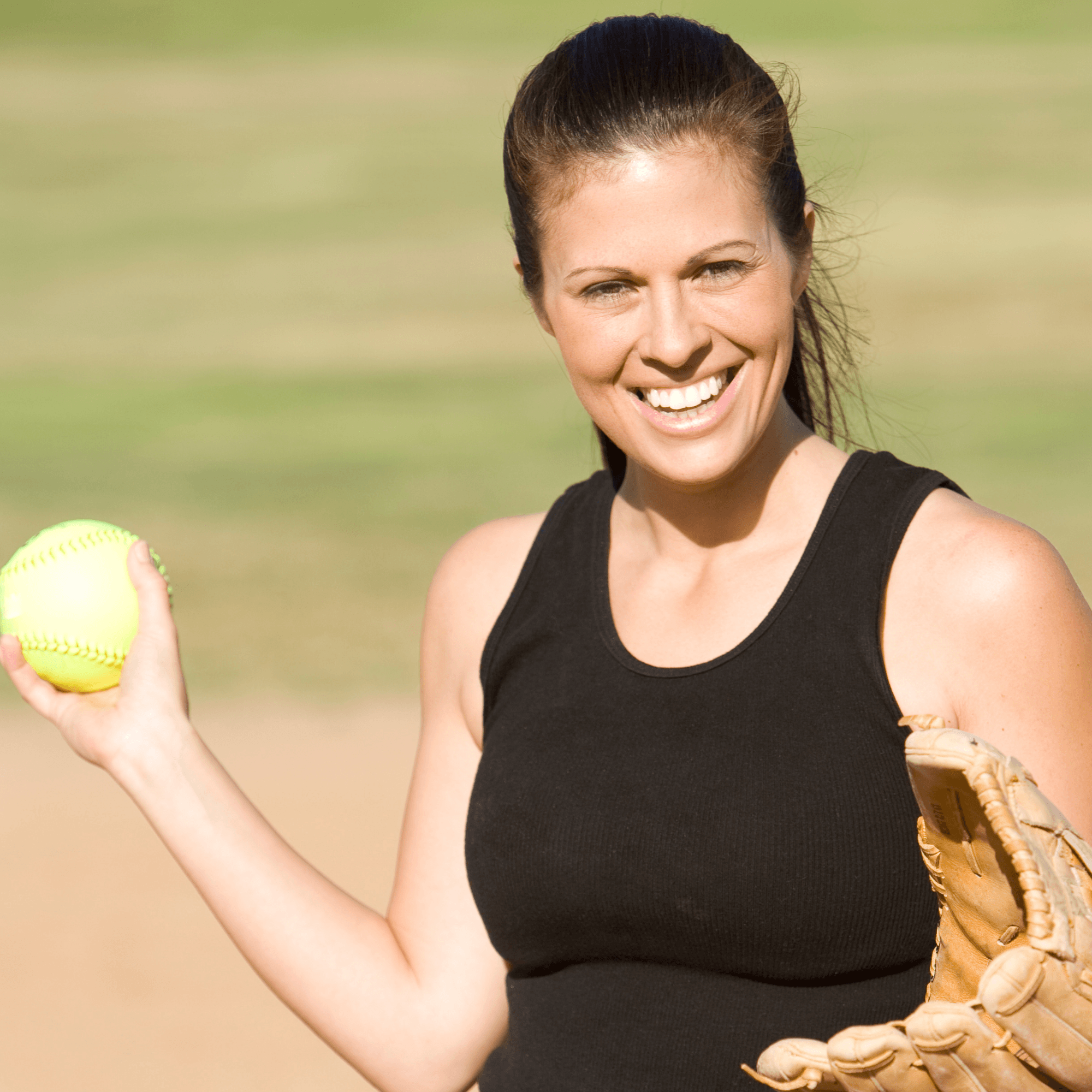 Woman holding softball 