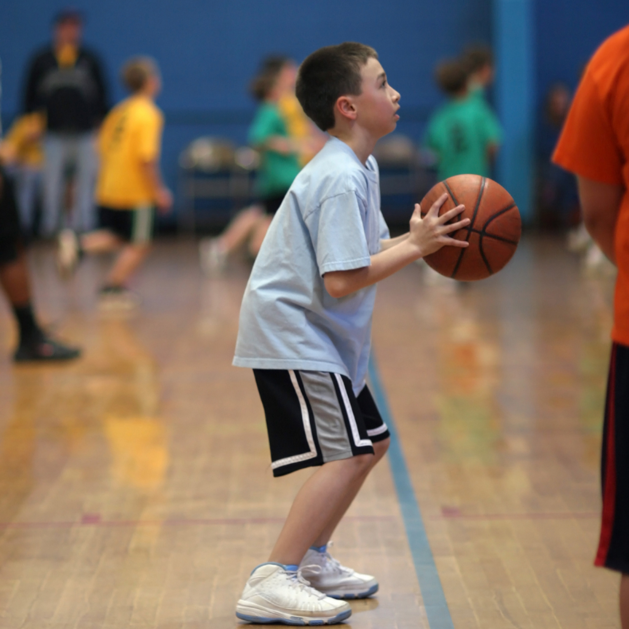 child playing basketball