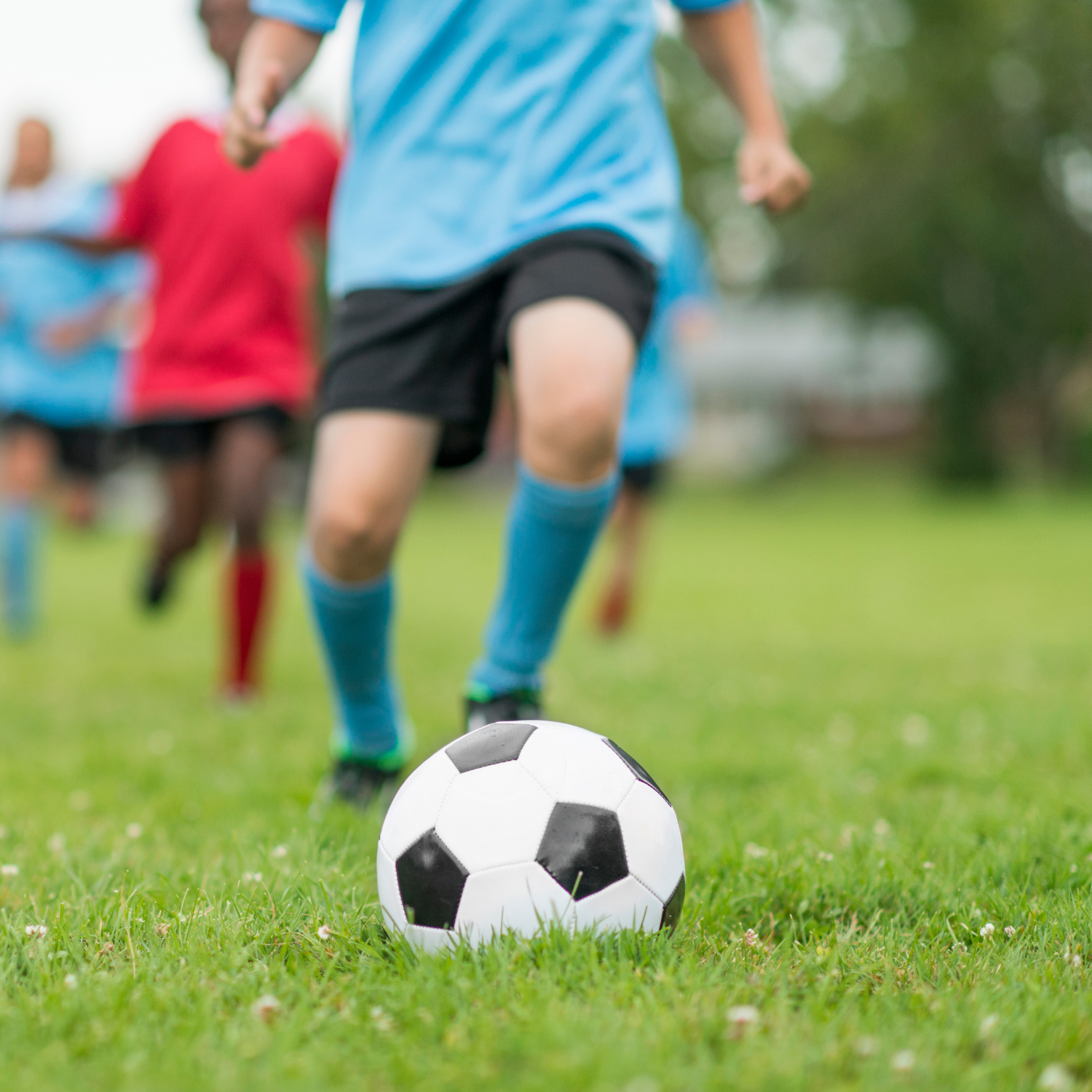 Child about to kick soccer ball