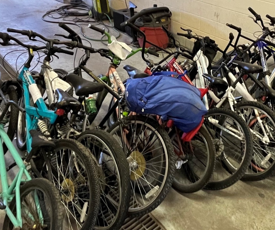 Image of 13 unclaimed bicycles in police storage 