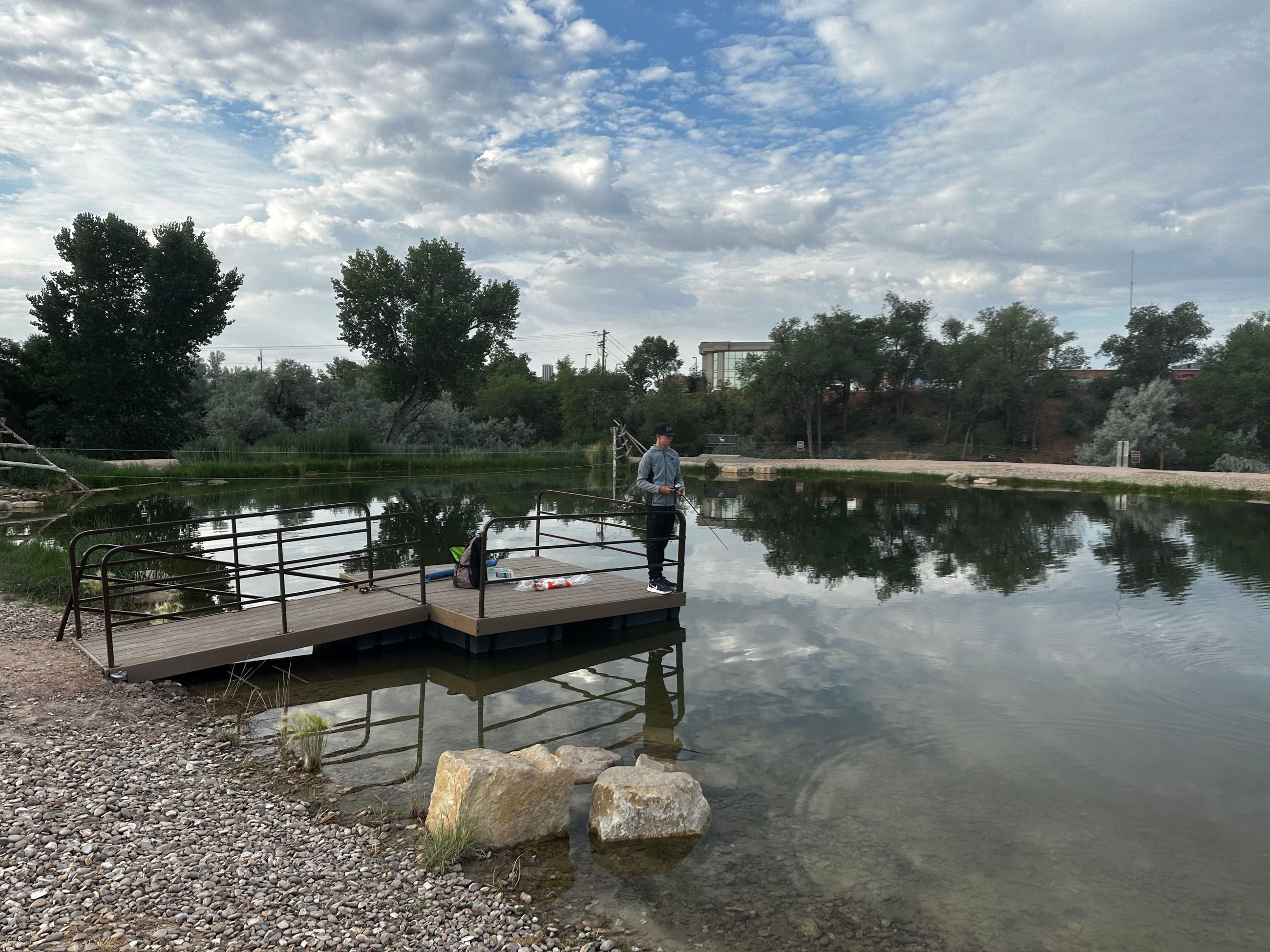 Child Fishing on Peer at Healing Pond at Roosevelt Nature Park 